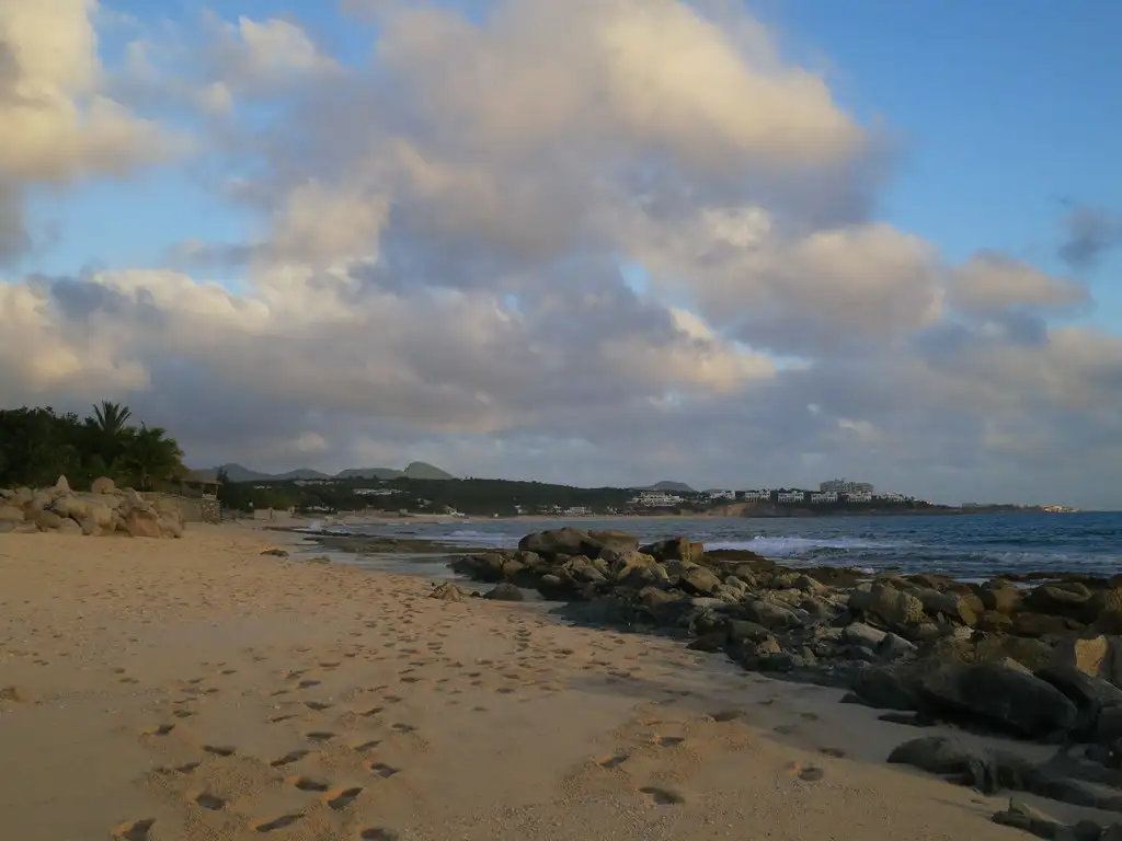 The far end of Baie Longue where the sand runs up against a low rocky headland