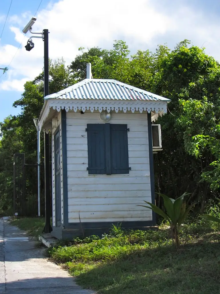 The small gatehouse at the road entrance to the Terres Basses residential estate