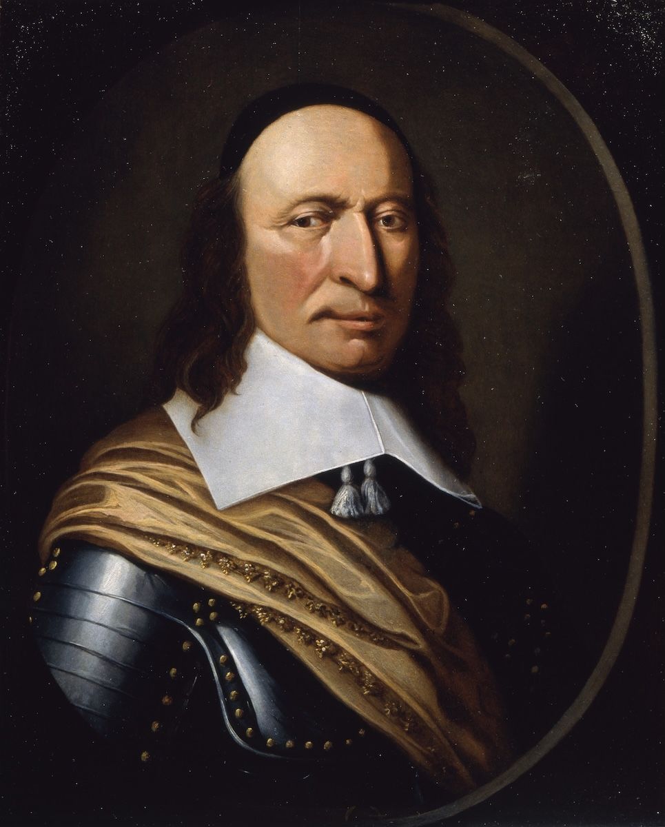An oil portrait of a stern man with long dark hair and a white collar, shown half-length against a dark background.