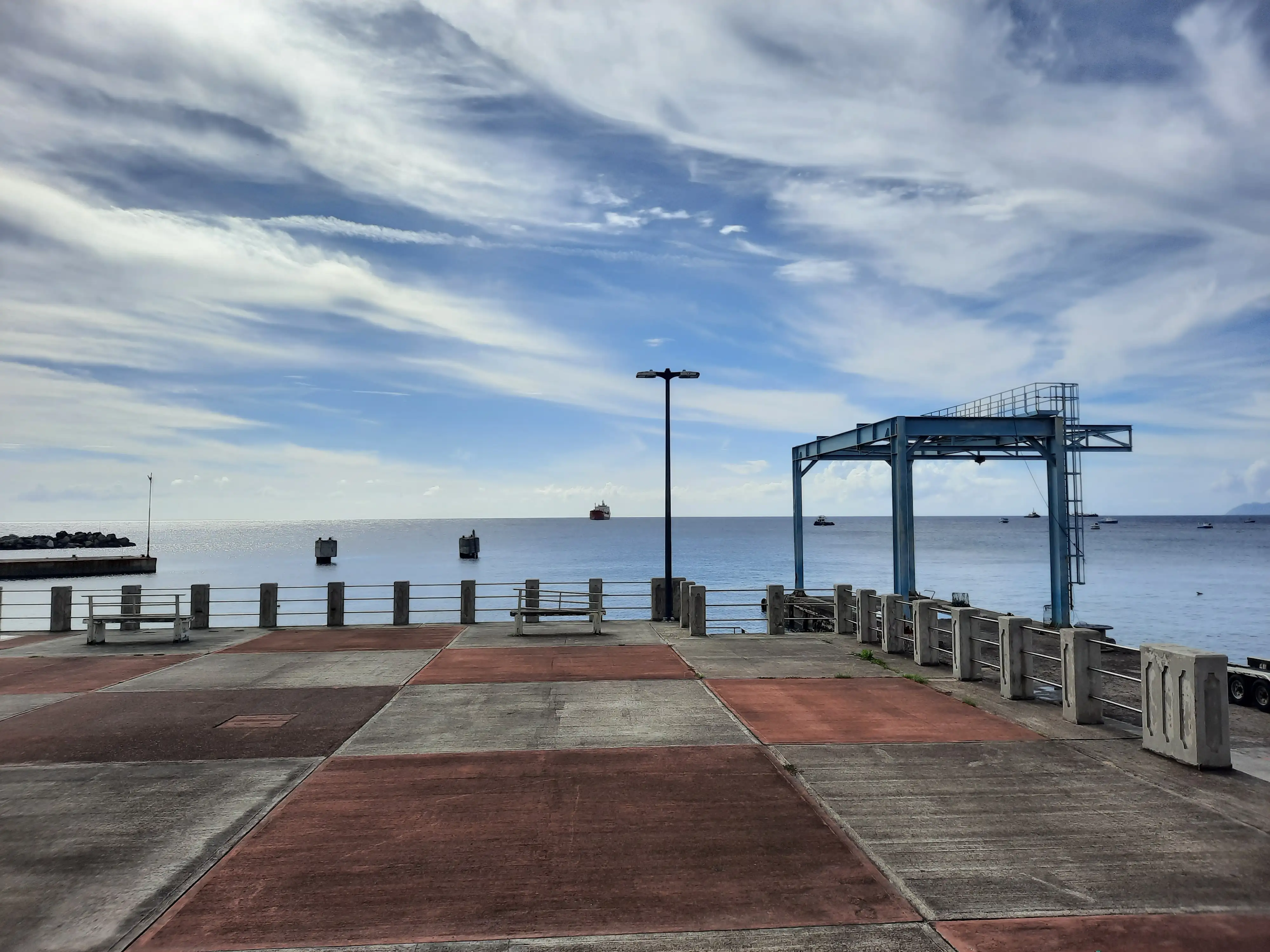 The concrete pier and loading gantry of the harbour terminal at Oranjestad on Sint Eustatius, with the sea beyond