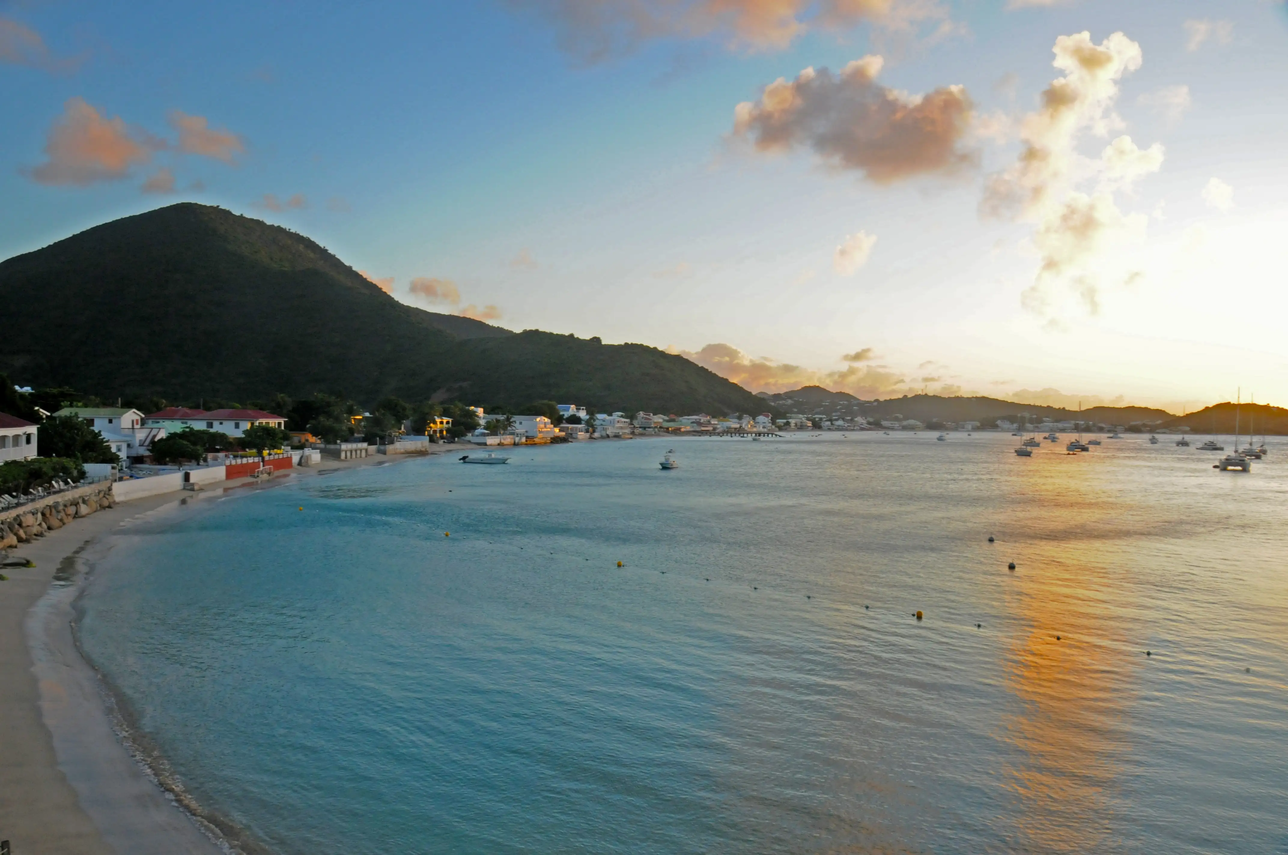 Grand Case Bay seen along the water from the northern end of the village, with the coastline curving away