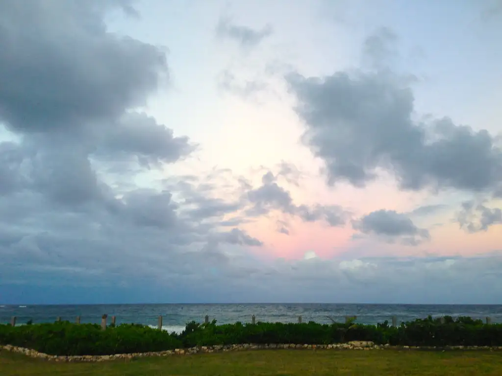 Sunset clouds massing over the water at Guana Bay on the Atlantic east side of Sint Maarten