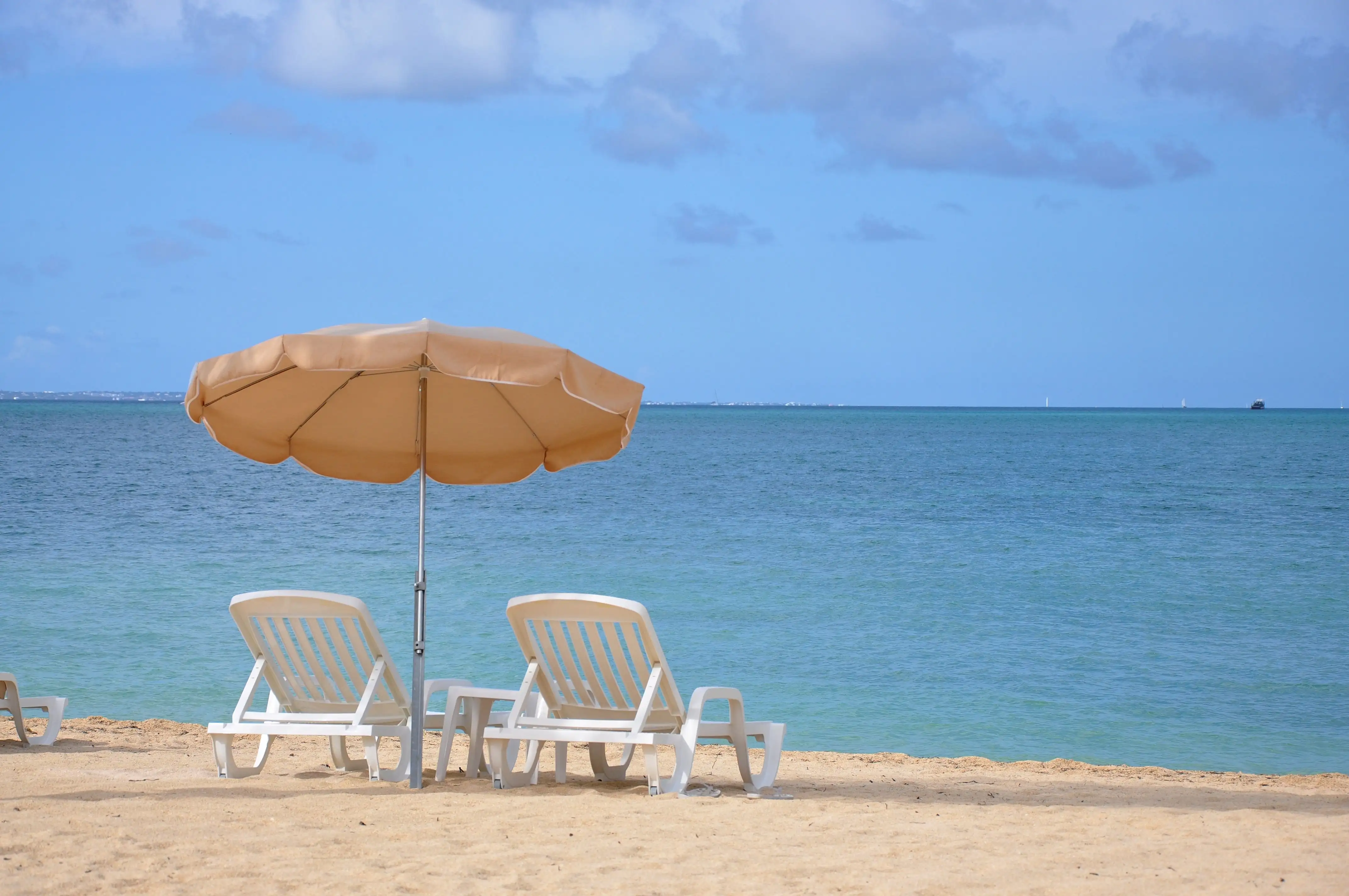 The sandy beach at Baie Nettlé on the French side of Saint Martin, with the water running along the shore