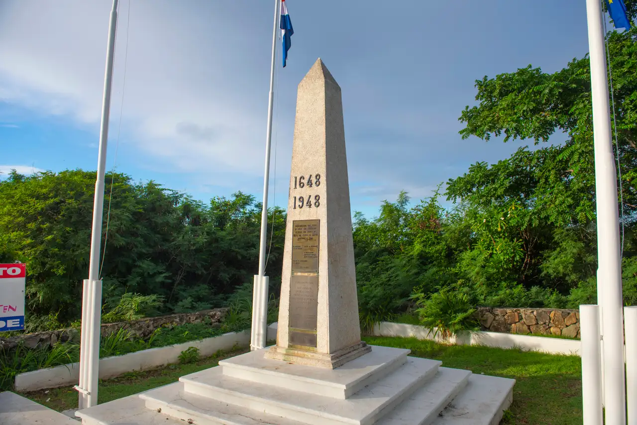 The 1648/1948 border monument obelisk marking the boundary between French St Martin and Dutch Sint Maarten